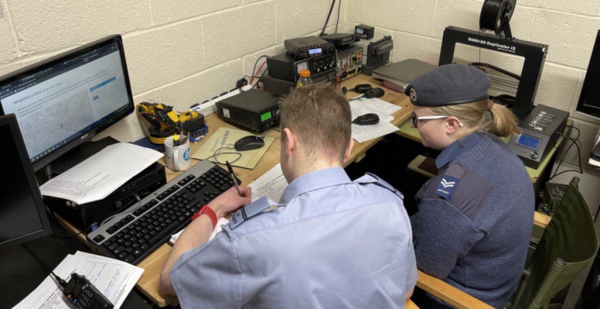 Plt Off Wale &amp; Cpl Blackwell updating the contact log book